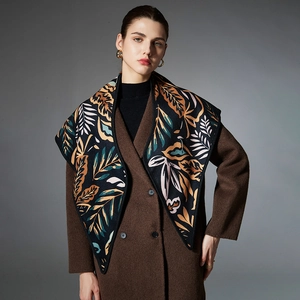 Elegant autumn triangle shawl with black and caramel paisley leaf jacquard pattern