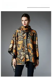 Detail of autumn leaf pattern on a double-sided reversible poncho wrap with black stitching