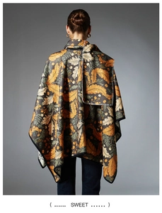 Detail of autumn leaf pattern on reversible shawl with premium contrast stitching