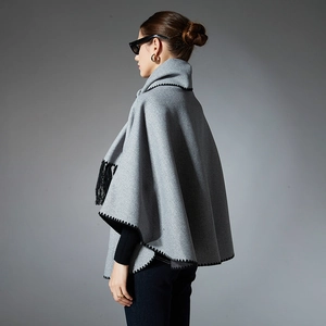 Elegant grey poncho shawl with black wave embroidery and tassels for autumn winter fashion