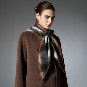 Classic plaid wool triangle shawl scarf for women in autumn winter tones with fringe detail