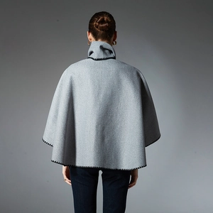 Grey pocket shawl scarf with black contrast stitching detail shown from a back view