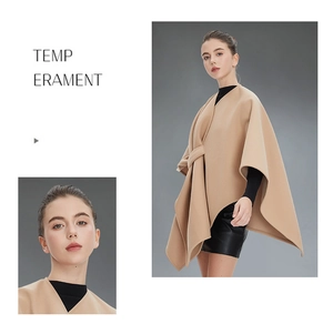 Close-up of elegant camel sleeveless cape coat with tie-belt and smooth wool texture