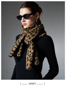 Detail of soft leopard print scarf for women showing thick texture and knotted styling