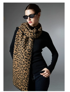 Detail of classic leopard print scarf with whipstitch edges on a premium woven fabric