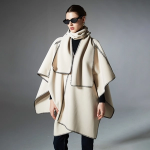 Women's cream wool blend shawl cape with black contrast hand-stitched edging and elegant drape