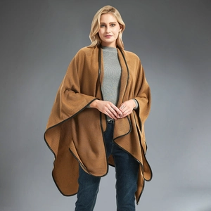 Women's camel knit poncho cape with black faux leather trim and open front style