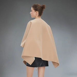 Elegant camel sleeveless poncho cape for women featuring a minimalist drape silhouette