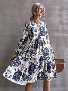 Elegant white midi dress with blue floral print, V-neck and lantern sleeves for women