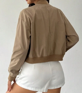 Rear view of khaki short bomber jacket showing ribbed hem and relaxed casual fit