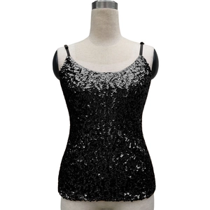 Close-up of black sequins on a women's camisole top with shimmering texture