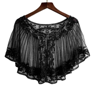 Detailed close-up of a 1920s style black tulle shawl with intricate floral sequins and beads