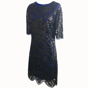 Close-up of navy blue mesh dress with vintage beaded bronze and black sequin patterns