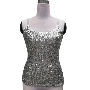 Close-up of sparkling silver sequins on the slim fit camisole top with thin straps
