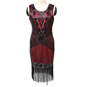 Retro 1920s flapper evening dress with black sequins and tassels on white background