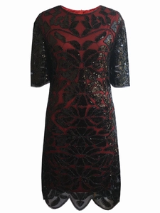 Detail of red and black sequin patterns and wavy hem on a 1920s vintage dress