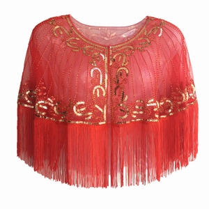 Detail of red mesh shawl with gold sequin embroidery and decorative beaded tassels