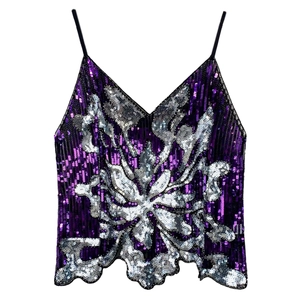 Detailed close-up of purple sequin halter top featuring shiny silver floral pattern