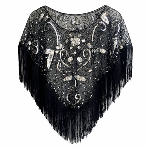 Detailed view of black vintage shawl with silver sequins, beads and long fringe hem