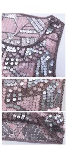 Detailed view of pink and silver sequins with intricate beadwork on mesh fabric