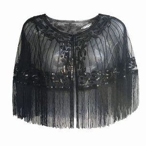 Detailed view of 1920s vintage black mesh shawl with sequin embroidery and long fringe trim
