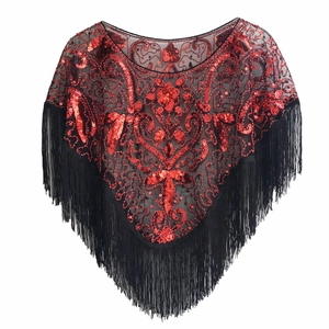 Detail of vintage 1920s mesh shawl featuring red sequins, floral patterns, and long fringe