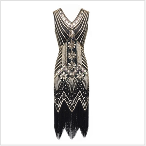 Vintage 1920s Gatsby style black dress with gold sequins and fringe hem details
