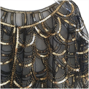 Vintage 1920s black mesh cape with intricate gold sequins and deco beading patterns