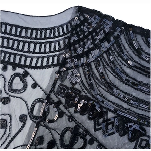 Vintage 1920s black sequin shawl with intricate geometric embroidery on mesh