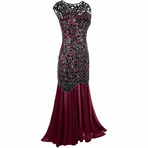 Detail of the intricate black lace and red sequins on the vintage evening gown bodice