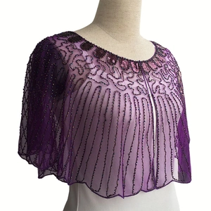 Detailed view of purple lace bolero with sequins and beaded fringe for evening dresses