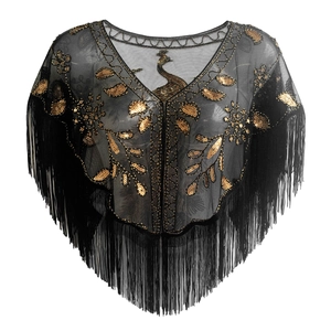 Detail of black mesh shawl with gold peacock embroidery and long fringe hemline