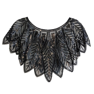 Detailed close-up of 1920s vintage sequin evening shawl with intricate leaf patterns