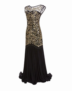 Detail of elegant gold leaf sequins on sheer black mesh of the 1920s vintage evening dress