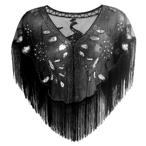 Close-up of vintage black mesh shawl featuring peacock embroidery, sequins, and long fringe