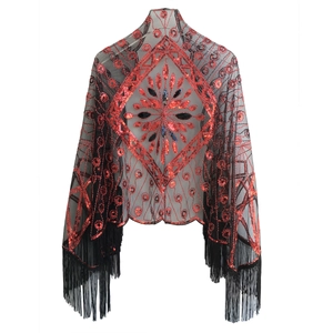 Detail of 1920s vintage black mesh shawl with red sequins and fringed edges