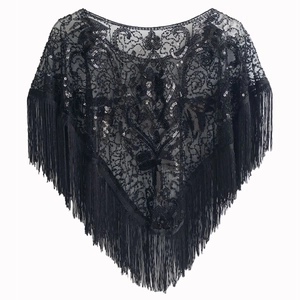 Detail of 1920s vintage black lace shawl featuring intricate sequins and long fringe