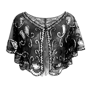 Detailed macro view of black mesh shrug with silver paisley sequins and scalloped edges