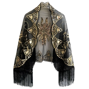 Detail of vintage Gatsby style black mesh shawl with gold sequins and fringe