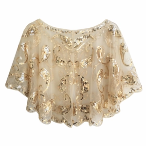 Detail of vintage champagne mesh shawl with intricate gold sequin paisley patterns