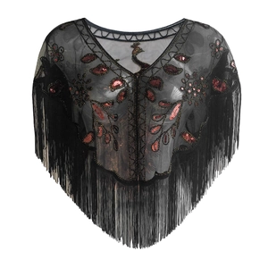 Detail of red peacock sequin embroidery and black fringe tassels on a mesh shawl