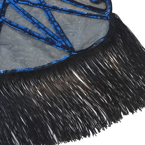 Detail of blue sequins on black mesh fabric with elegant long hanging fringes