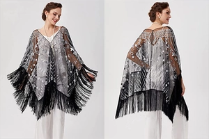 Detail of 1920s vintage black mesh shawl with silver sequins and long fringe trim