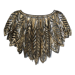 Close-up of vintage Art Deco black mesh capelet with intricate gold leaf-patterned sequins
