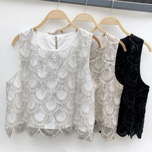 Women's sleeveless sequined crop top in white, champagne, and black with scallop patterns