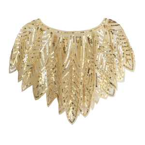 Detail showing golden sequins arranged in a leaf pattern on light mesh evening shawl