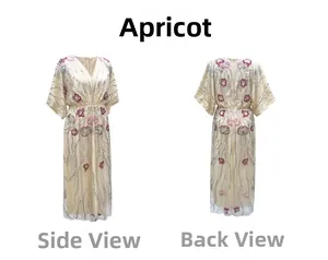 Détail de profil et de dos de la robe longue abricot col en V avec paillettes et broderies