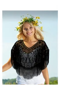 Detail of vintage black mesh shawl with sequins, intricate beadwork and long tassels