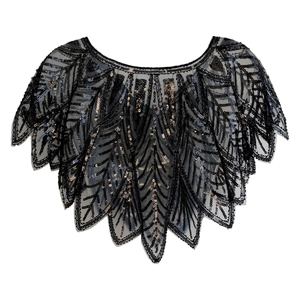 Close-up of vintage black mesh shawl with intricate sequin patterns for evening gowns