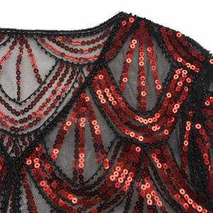 Detailed close-up of 1920s mesh shawl featuring red sequins in retro wave patterns